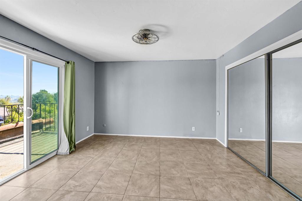 735 South Upas Street Escondido, CA 92025 - Photo 16 of 28 an empty room with sliding door and balcony view