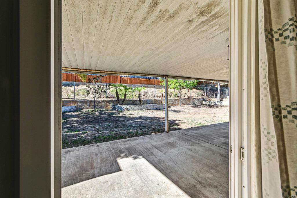 735 South Upas Street Escondido, CA 92025 - Photo 22 of 28 a view of a room with wooden floor and a floor to ceiling window