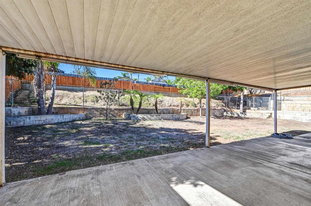 735 South Upas Street Escondido, CA 92025 - Photo 24 of 28 a view of a patio with a table and chairs under an umbrella