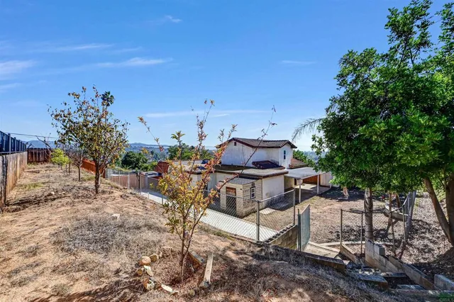 a view of a chairs and table in the patio