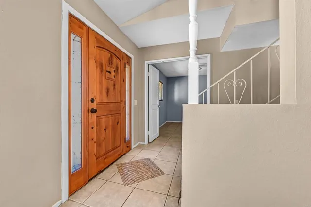 a view of a hallway with closet and entryway