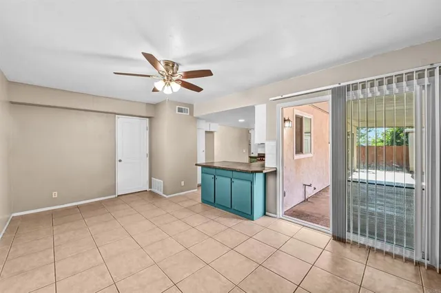 a view of workspace with wooden floor and a ceiling fan