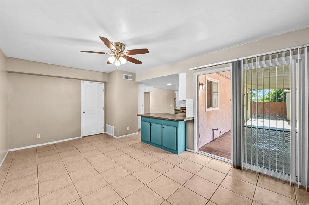 735 South Upas Street Escondido, CA 92025 - Photo 8 of 28 a view of workspace with wooden floor and a ceiling fan