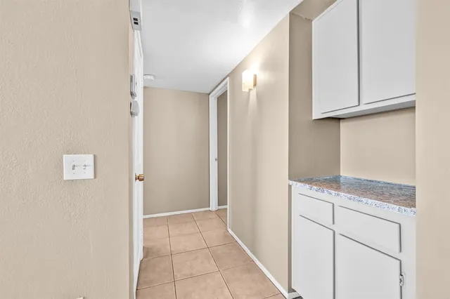 a view of cabinets and wooden floor