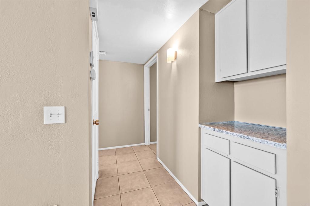 735 South Upas Street Escondido, CA 92025 - Photo 9 of 28 a view of cabinets and wooden floor