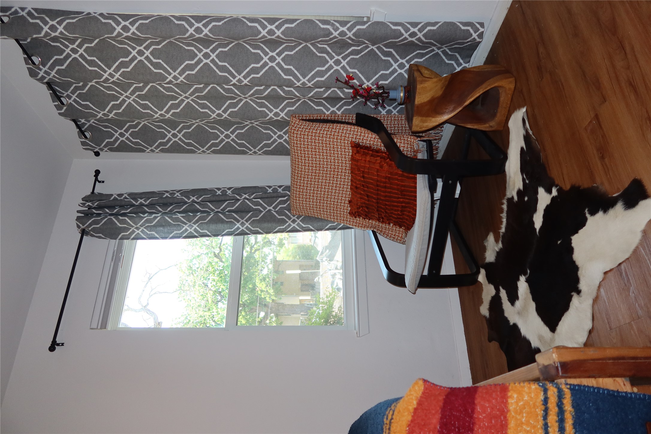 3400 Speedway, Unit 104 Austin, TX 78705 - Photo 16 of 23 Living area featuring dark wood-type flooring and baseboards