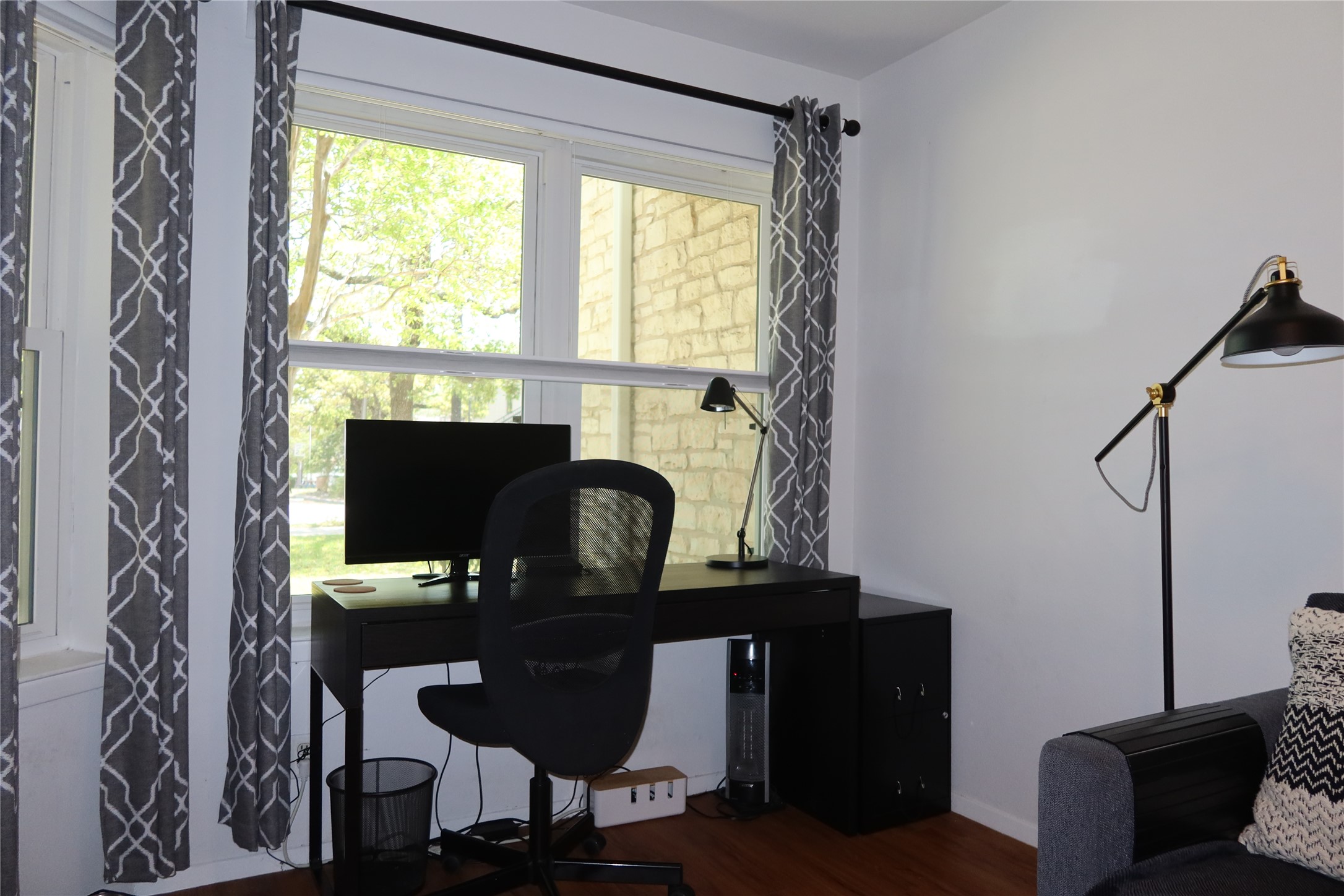 3400 Speedway, Unit 104 Austin, TX 78705 - Photo 6 of 23 Office area with dark wood-type flooring and baseboards