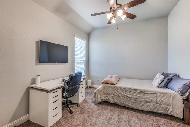 a bathroom with a tub a sink and mirror