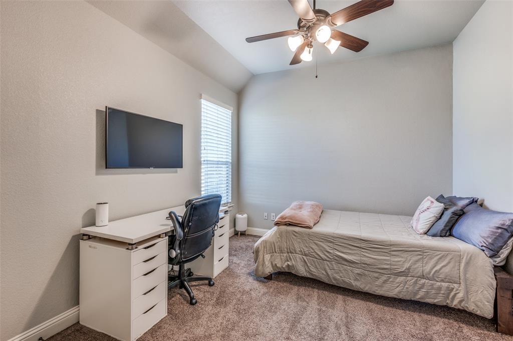 4140 Fm 2450 Krum, TX 76249 - Photo 15 of 28 a bedroom with a bed and a flat screen tv