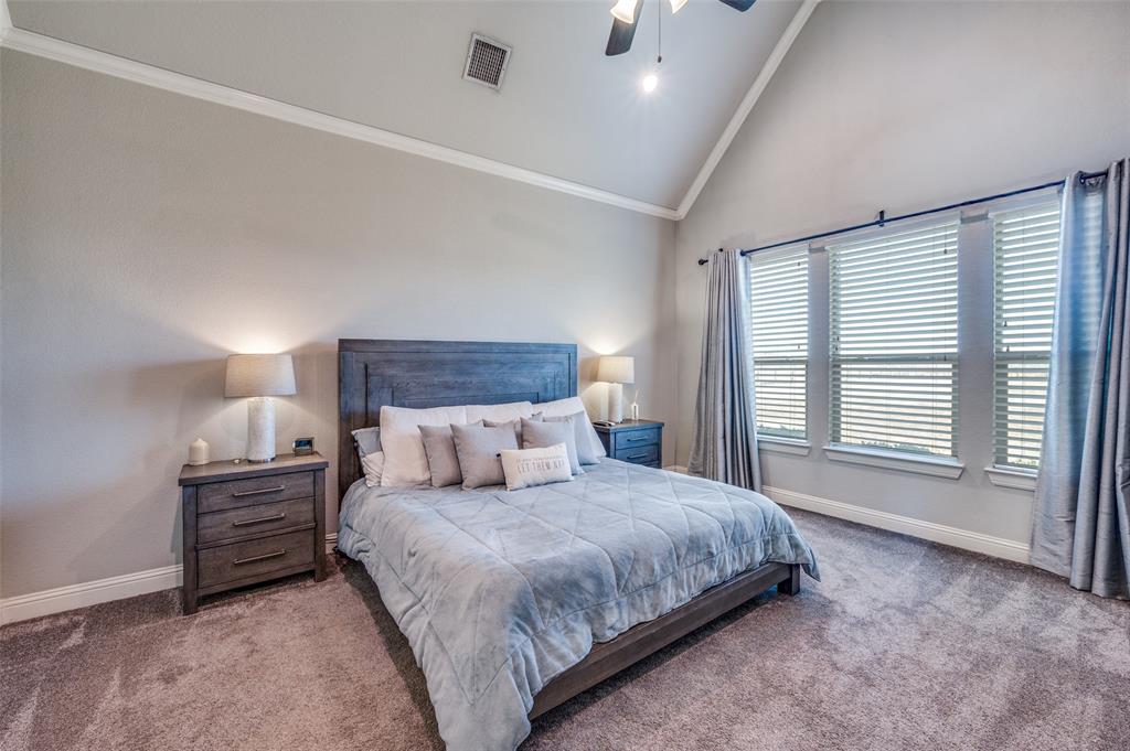 4140 Fm 2450 Krum, TX 76249 - Photo 20 of 28 a bedroom with a bed a lamp and a large window