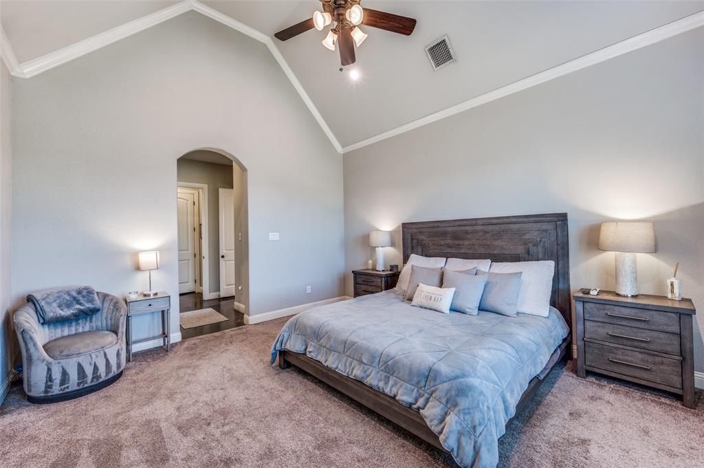 4140 Fm 2450 Krum, TX 76249 - Photo 21 of 28 a bedroom with a large bed and ceiling fan