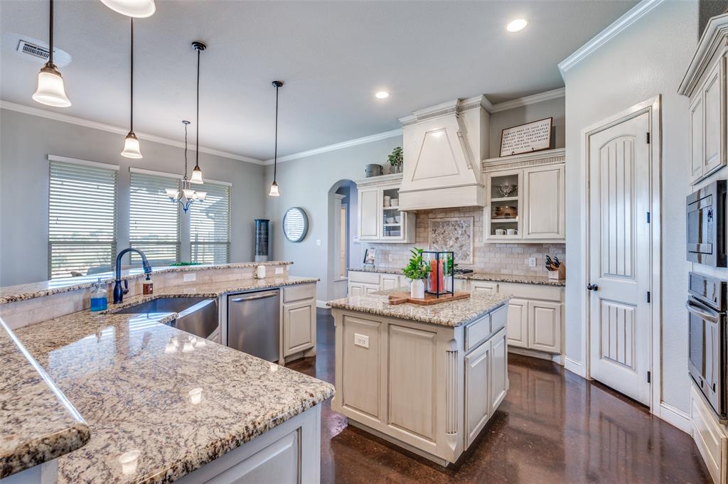 4140 Fm 2450 Krum, TX 76249 - Photo 3 of 28 a kitchen with white cabinets and appliances