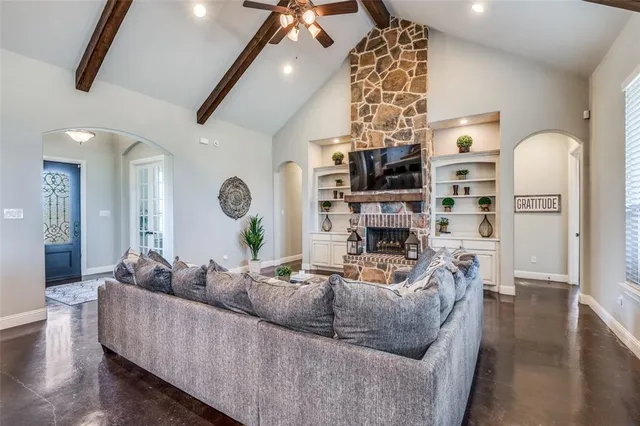 a living room with furniture and a fireplace