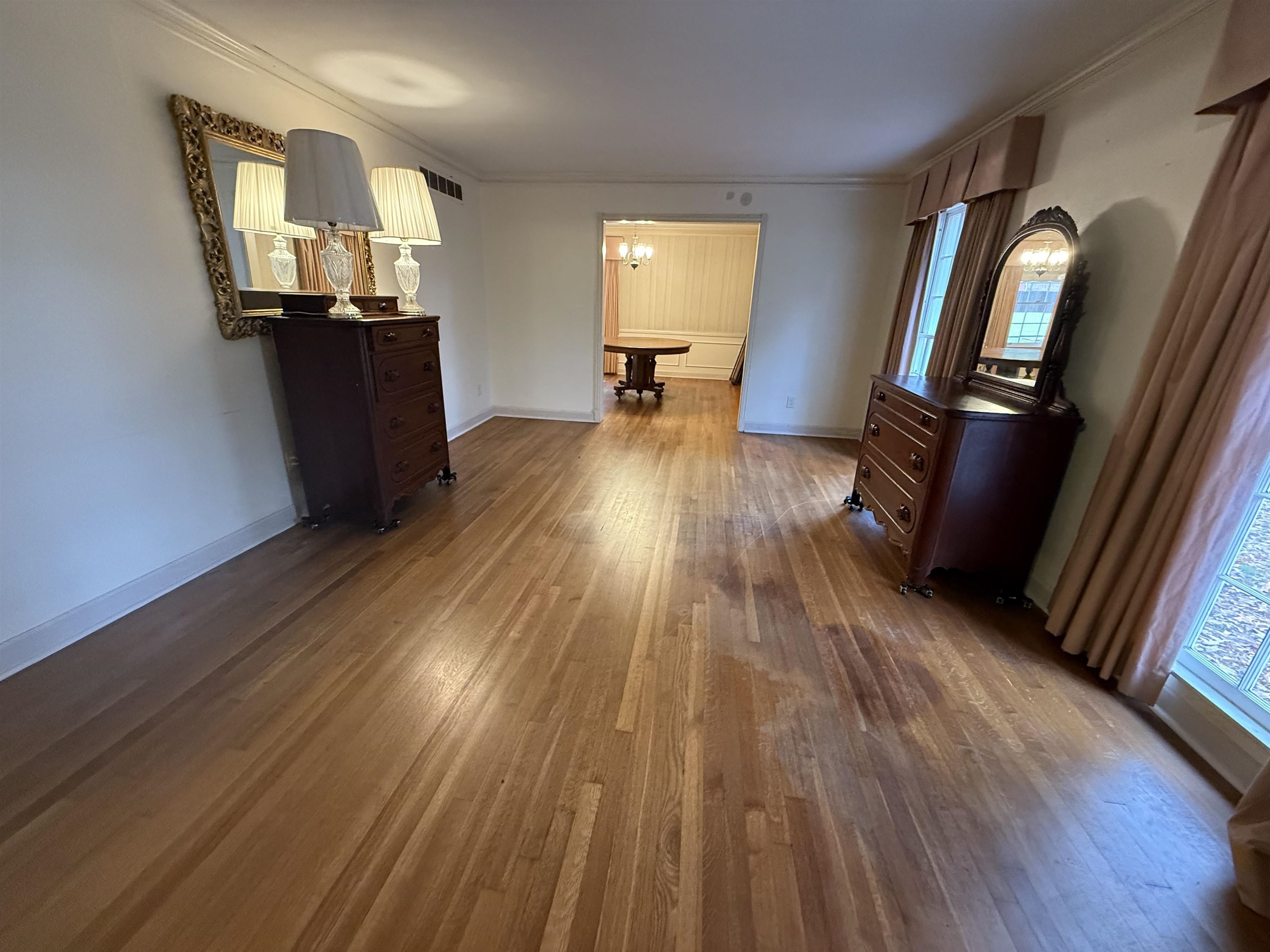 5575 Walnut Grove Road Memphis, TN 38120 - Photo 12 of 36 a view of a living room with wooden floor and furniture