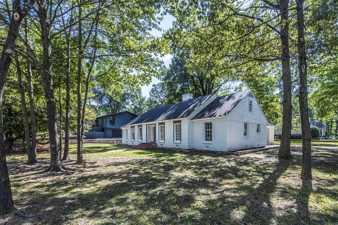 5575 Walnut Grove Road Memphis, TN 38120 - Photo 2 of 36 a view of a house with a yard and large tree
