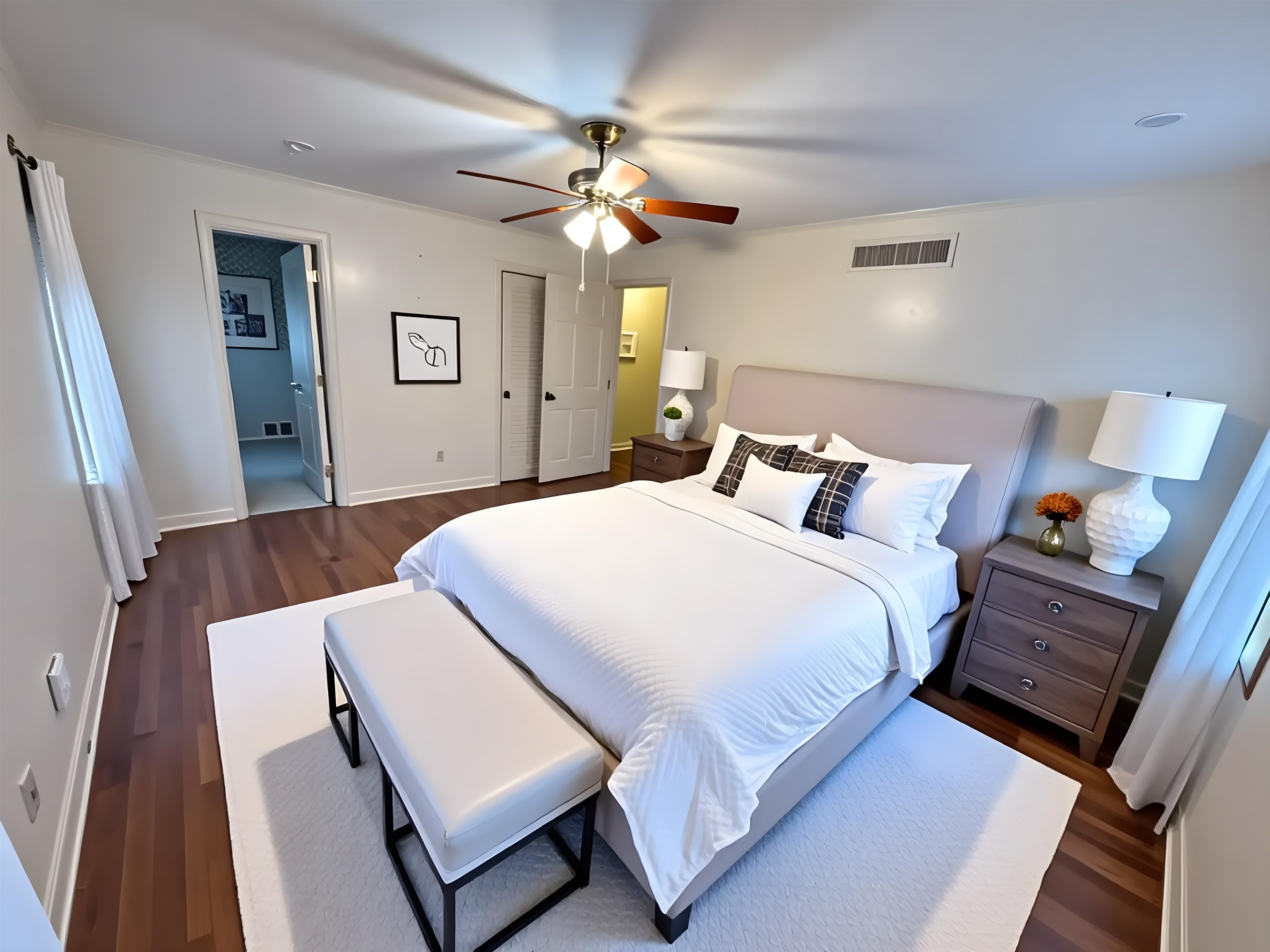 5575 Walnut Grove Road Memphis, TN 38120 - Photo 23 of 36 a bedroom with a bed and wooden floor