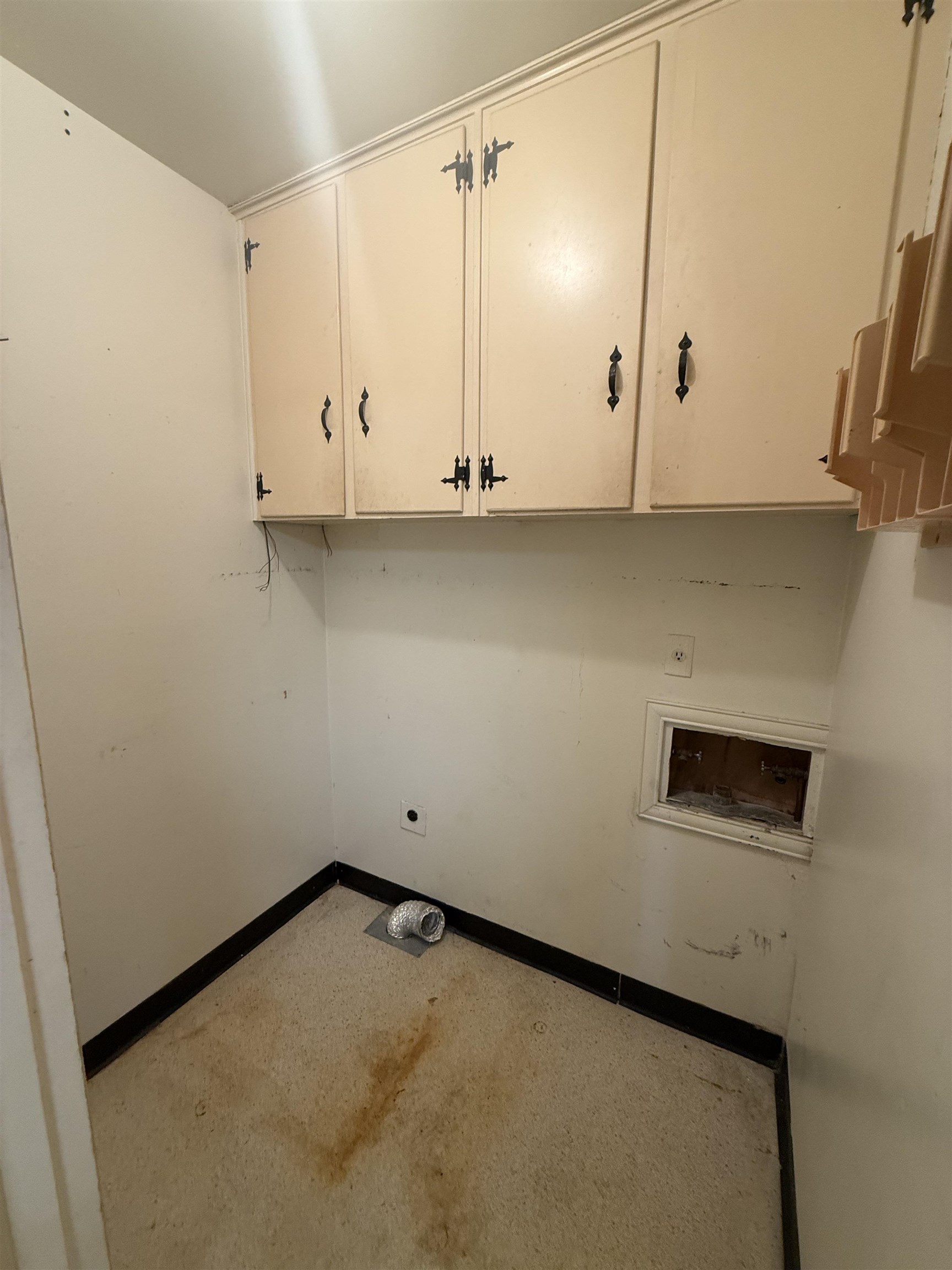 5575 Walnut Grove Road Memphis, TN 38120 - Photo 36 of 36 Laundry room featuring cabinet space, washer hookup, and concrete floors