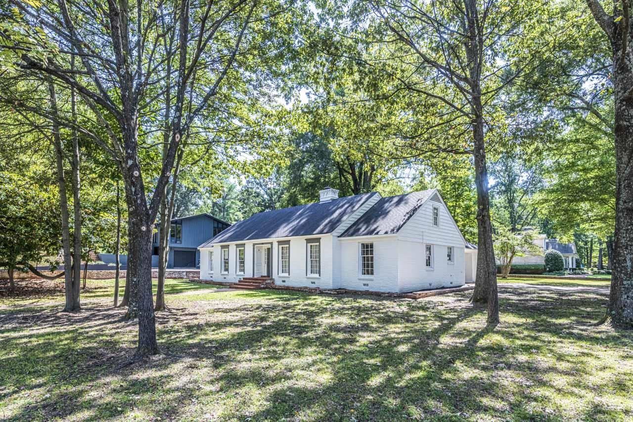 5575 Walnut Grove Road Memphis, TN 38120 - Photo 4 of 36 a house with trees in the background