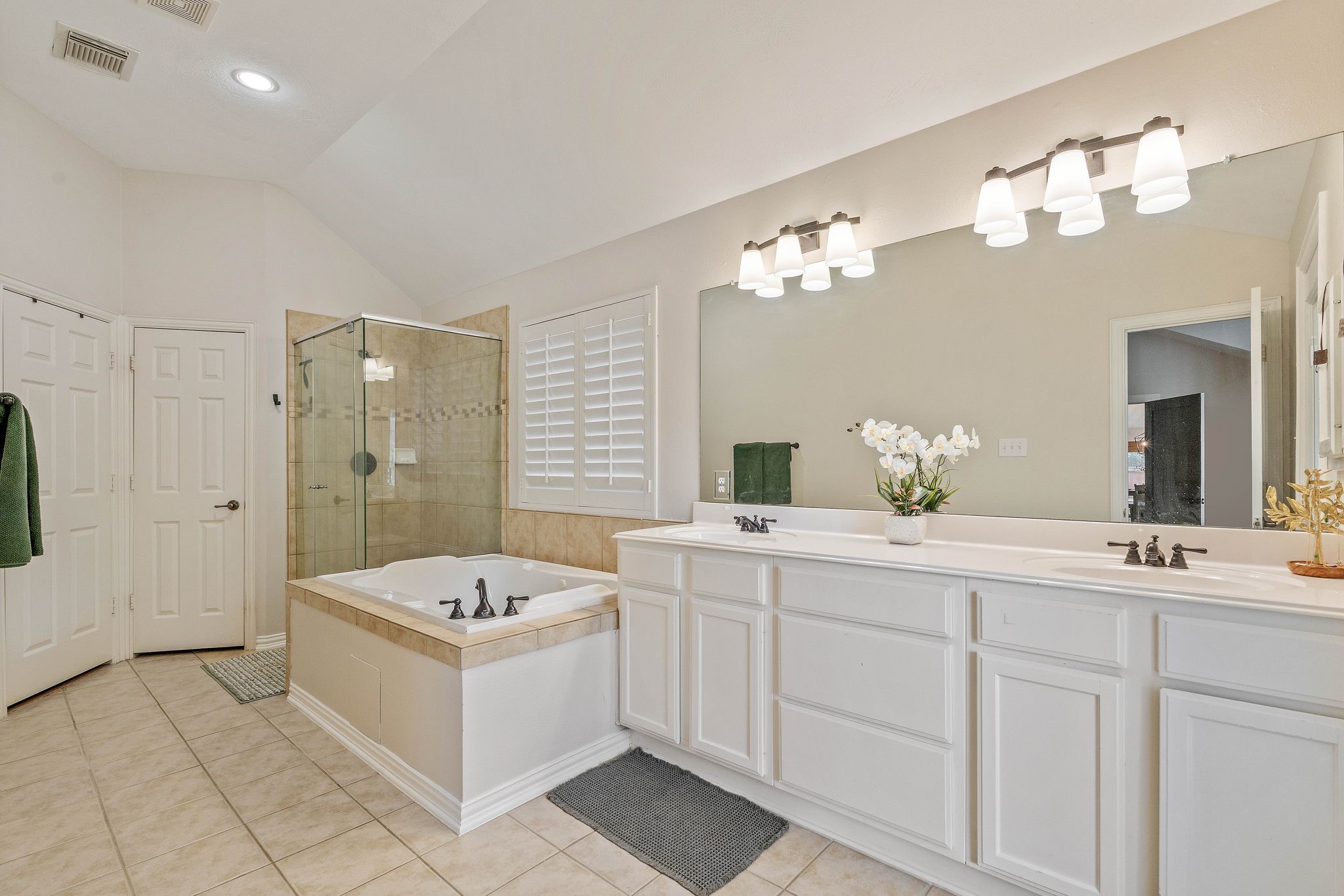 2408 Hollowbrook Lane Conroe, TX 77384 - Photo 21 of 49 Primary ensuite bathroom with jetted tub, separate walk in shower and dual basin vanity. Brand new lighting fixtures.