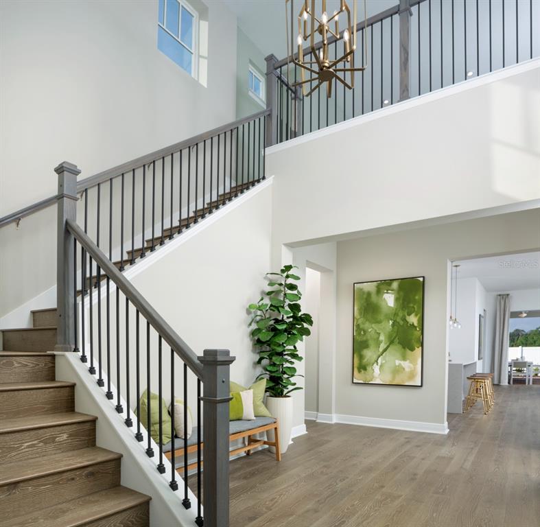2012 Beach Terrace Celebration, FL 34747 - Photo 4 of 26 a view of staircase with railing and a potted plant