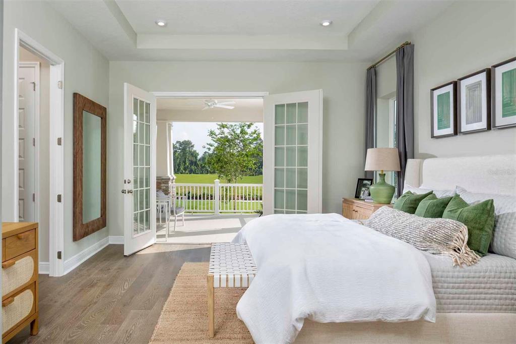 2012 Beach Terrace Celebration, FL 34747 - Photo 10 of 26 a bedroom with a large bed and a large window