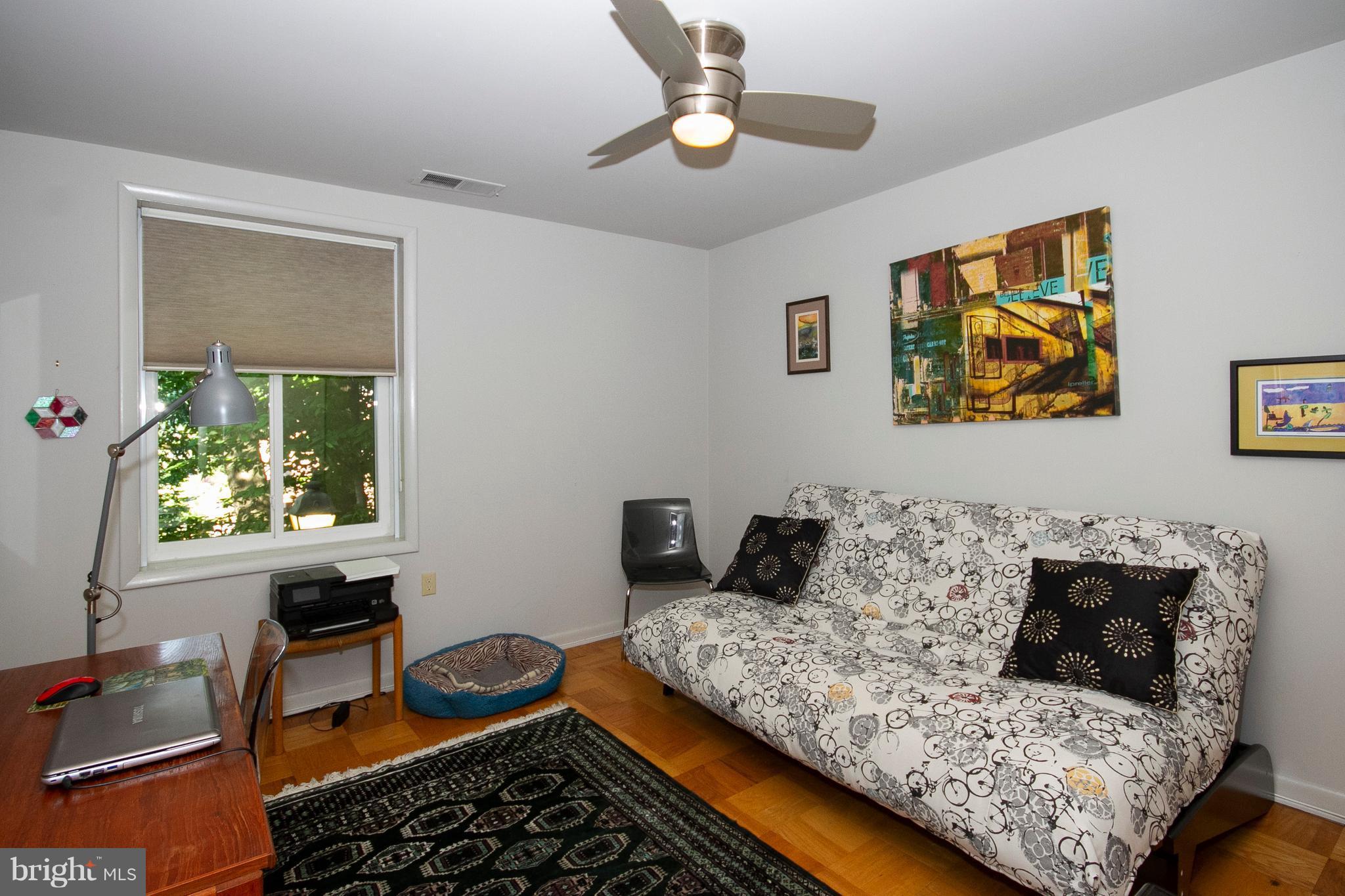 14 Cross Keys Road, Unit 14D Baltimore, MD 21210 - Photo 17 of 25 a living room with furniture and a window