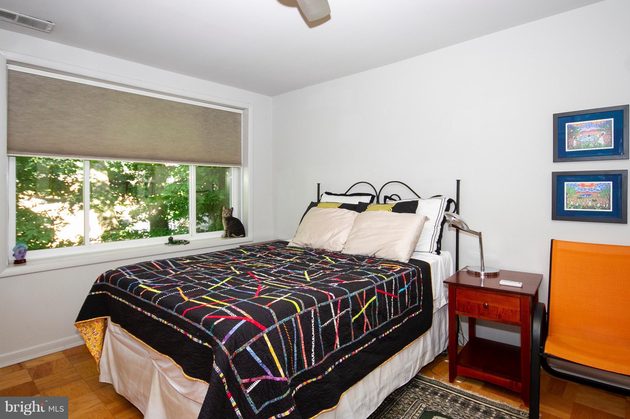 14 Cross Keys Road, Unit 14D Baltimore, MD 21210 - Photo 20 of 25 a bedroom with bed and a window