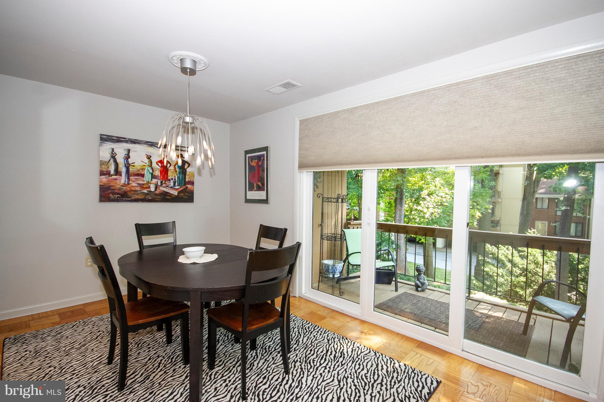 14 Cross Keys Road, Unit 14D Baltimore, MD 21210 - Photo 10 of 25 a view of a dining room with furniture window and outside view