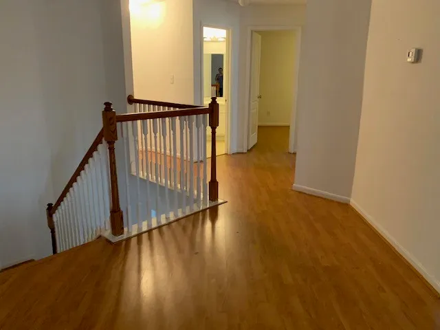 a view of an entryway with wooden floor