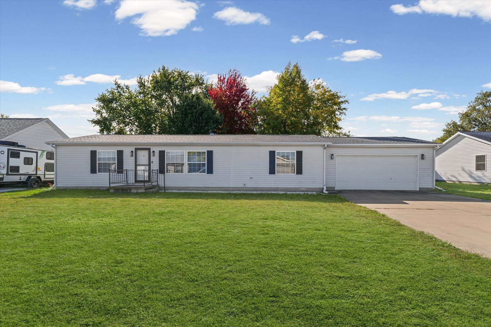 509 West Rhodes Street Thomasboro, IL 61878 - Photo 1 of 29 a view of a yard with a house