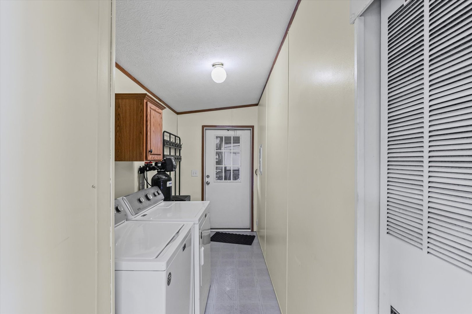 509 West Rhodes Street Thomasboro, IL 61878 - Photo 24 of 29 a view of a room that has a bed and a large mirror in it