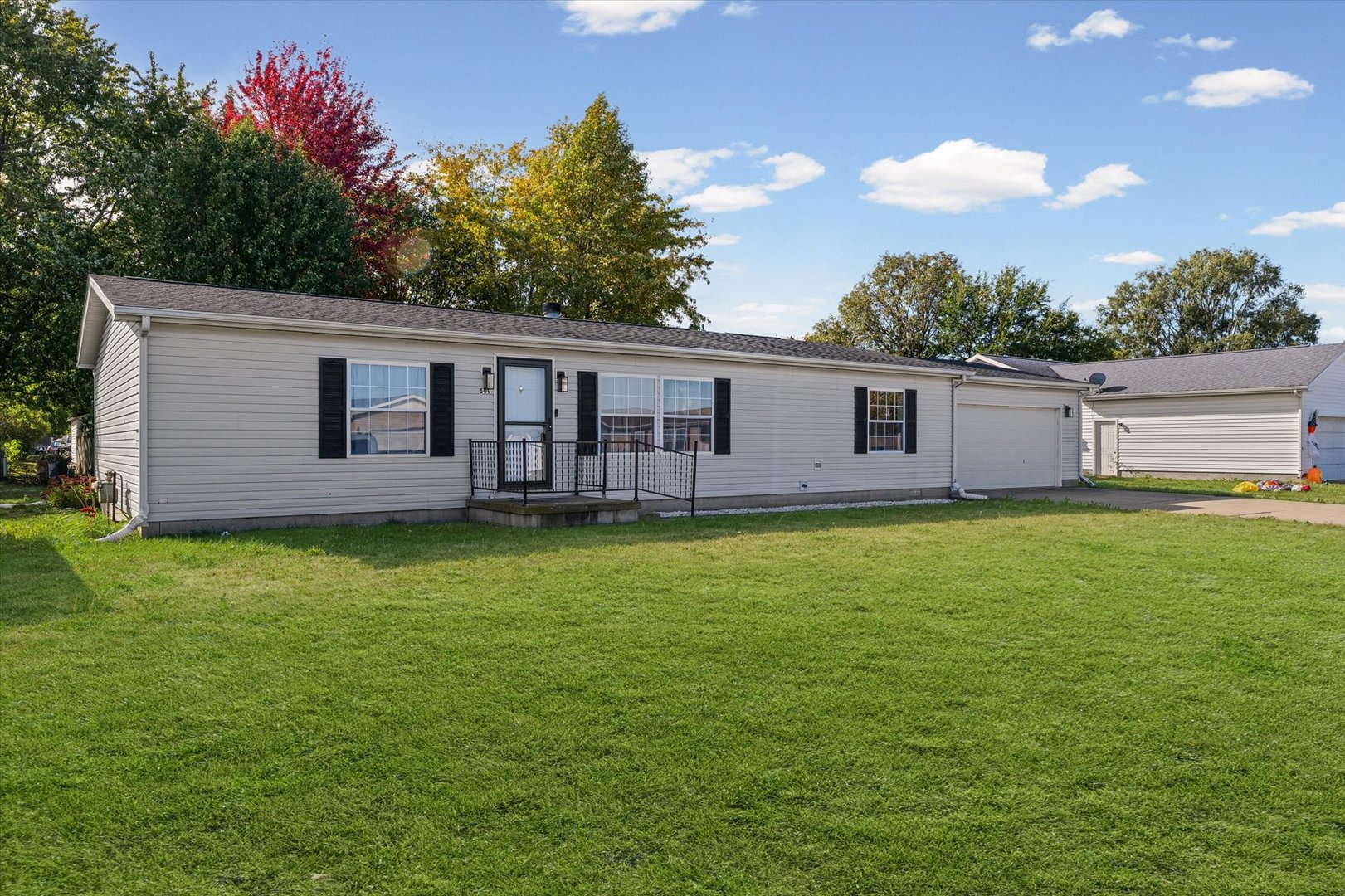 509 West Rhodes Street Thomasboro, IL 61878 - Photo 3 of 29 a view of a house with backyard and garden