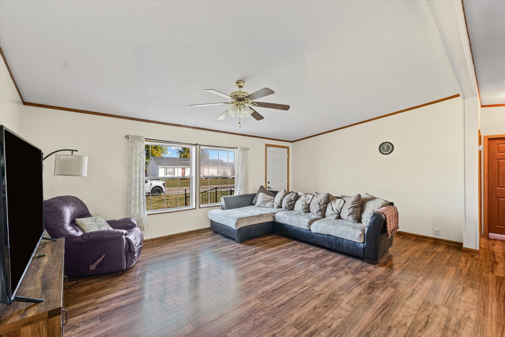 509 West Rhodes Street Thomasboro, IL 61878 - Photo 8 of 29 a living room with furniture and a large window