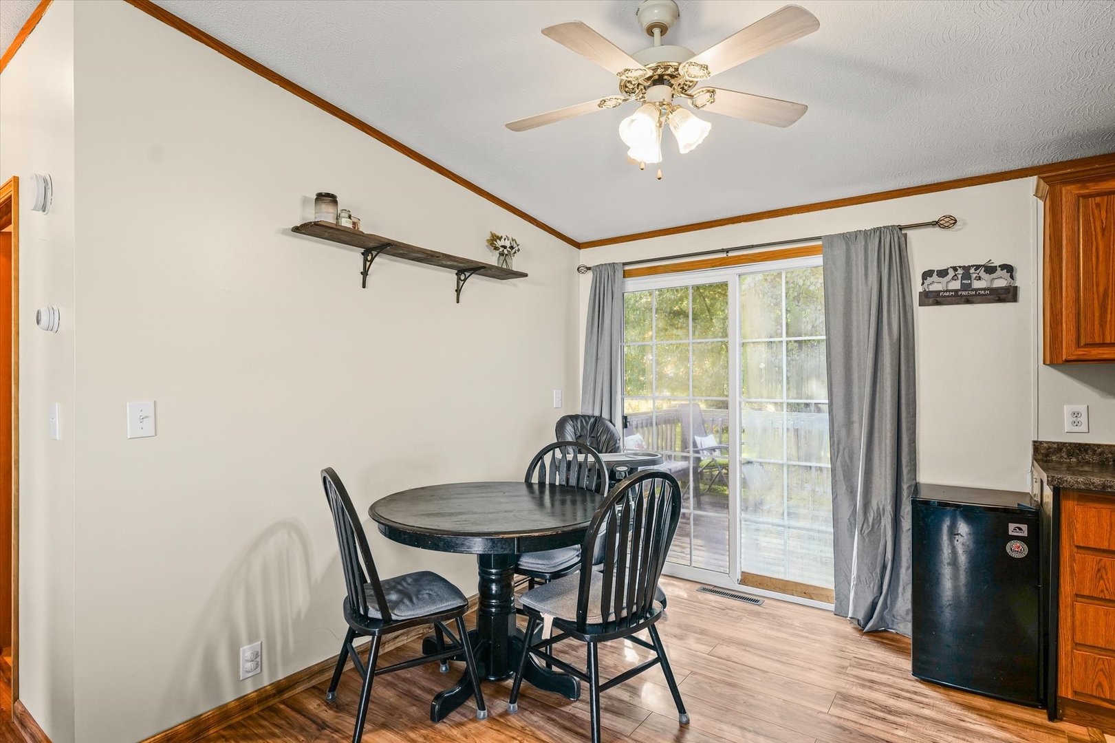 509 West Rhodes Street Thomasboro, IL 61878 - Photo 10 of 29 a view of a dining room with furniture window and wooden floor