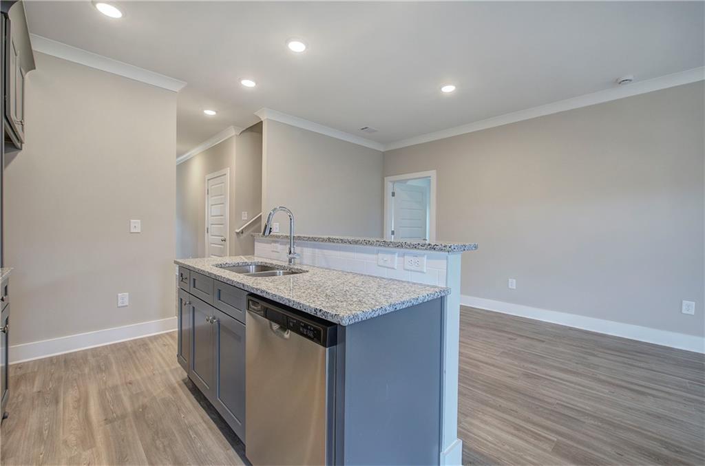 201 Daisy Court Cartersville, GA 30121 - Photo 15 of 36 a bathroom with a granite countertop sink a mirror and shower