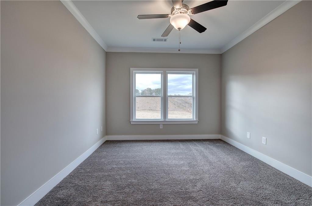 201 Daisy Court Cartersville, GA 30121 - Photo 20 of 36 an empty room with a window and a fan