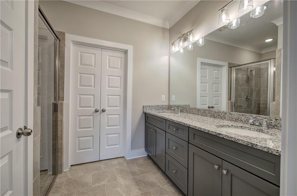 201 Daisy Court Cartersville, GA 30121 - Photo 21 of 36 a bathroom with a granite countertop sink and a mirror