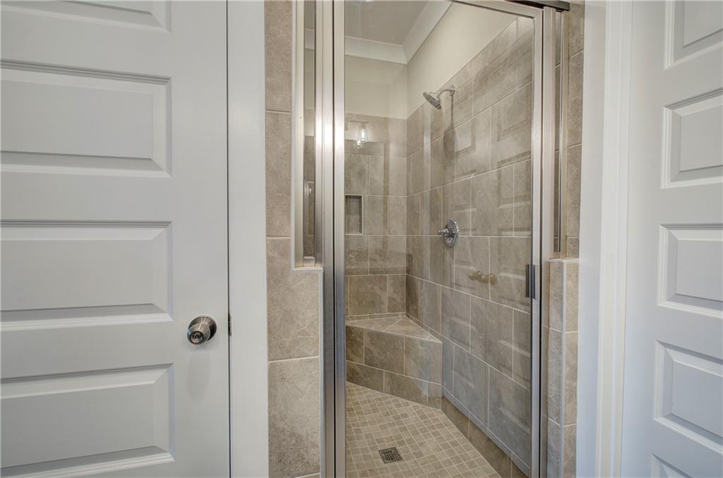 201 Daisy Court Cartersville, GA 30121 - Photo 22 of 36 a bathroom with a glass shower door