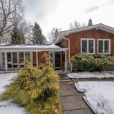 a front view of house with yard outdoor seating and barbeque oven