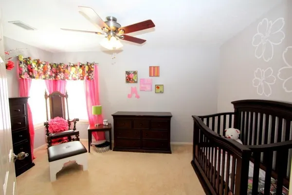 a bedroom with furniture and a fireplace