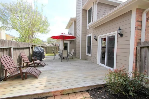 a view of a dinning tables and chairs in patio of the house