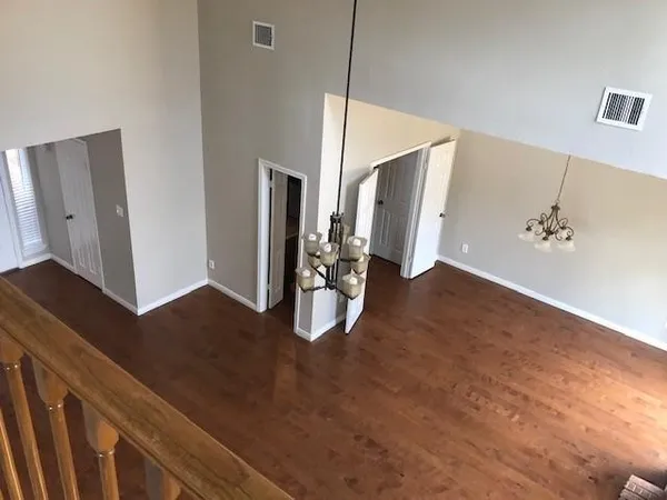 a view of an entryway with wooden floor