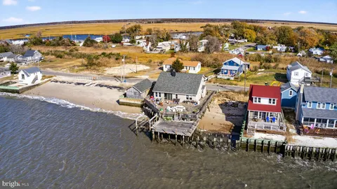 an aerial view of a house with a swimming pool