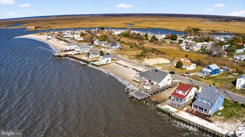 a picture of a bench in front of a wall