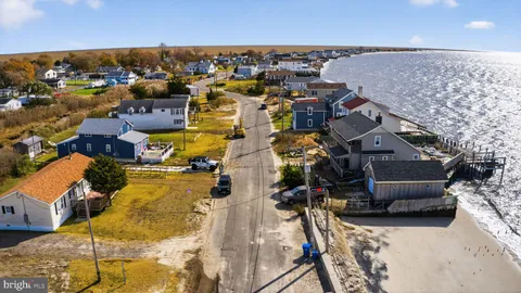 a kitchen that has a lot of cabinets in it and appliances