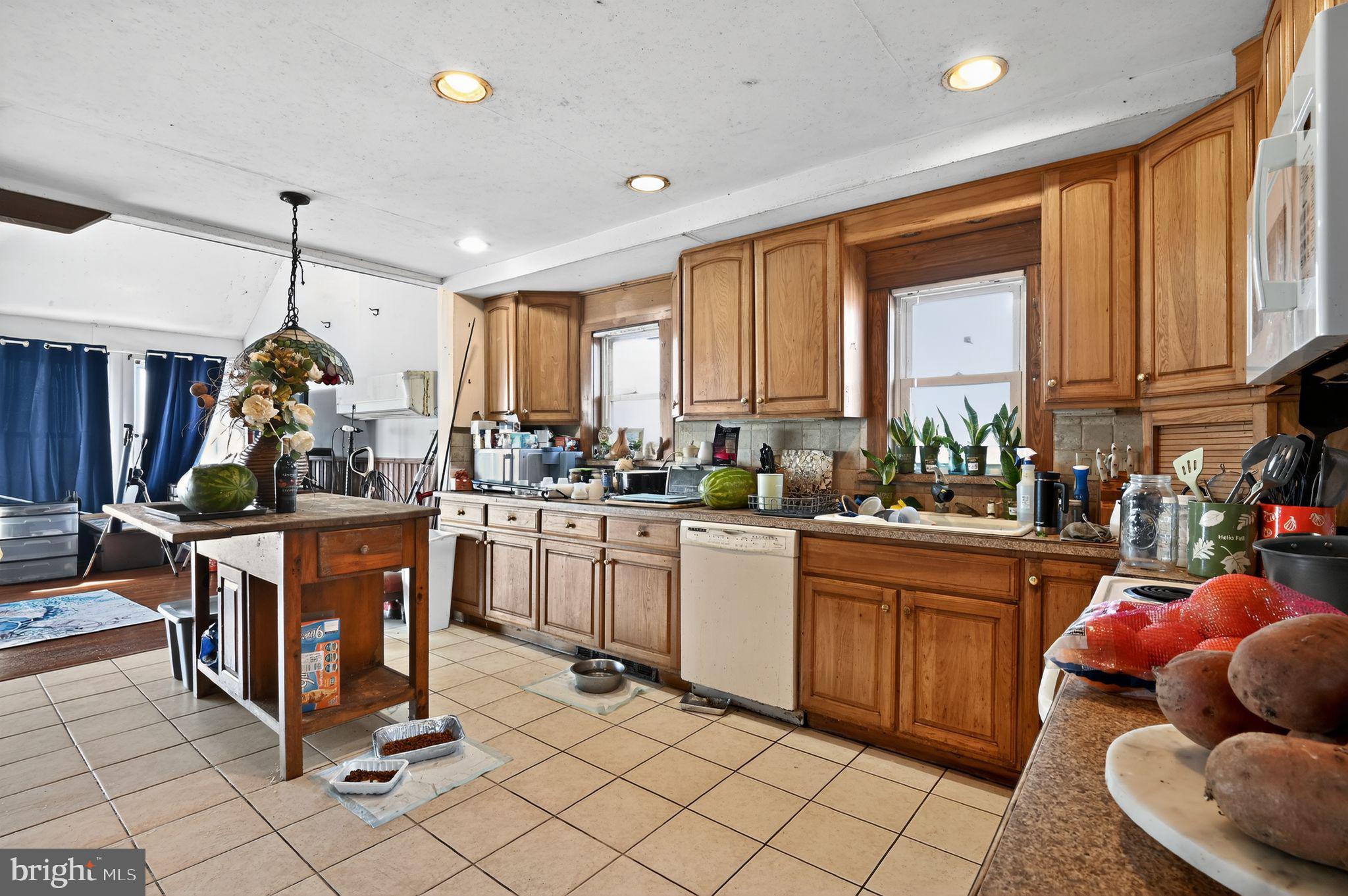 114 Delaware Avenue Fortescue, NJ 08321 - Photo 22 of 27 a kitchen that has a lot of cabinets in it and appliances
