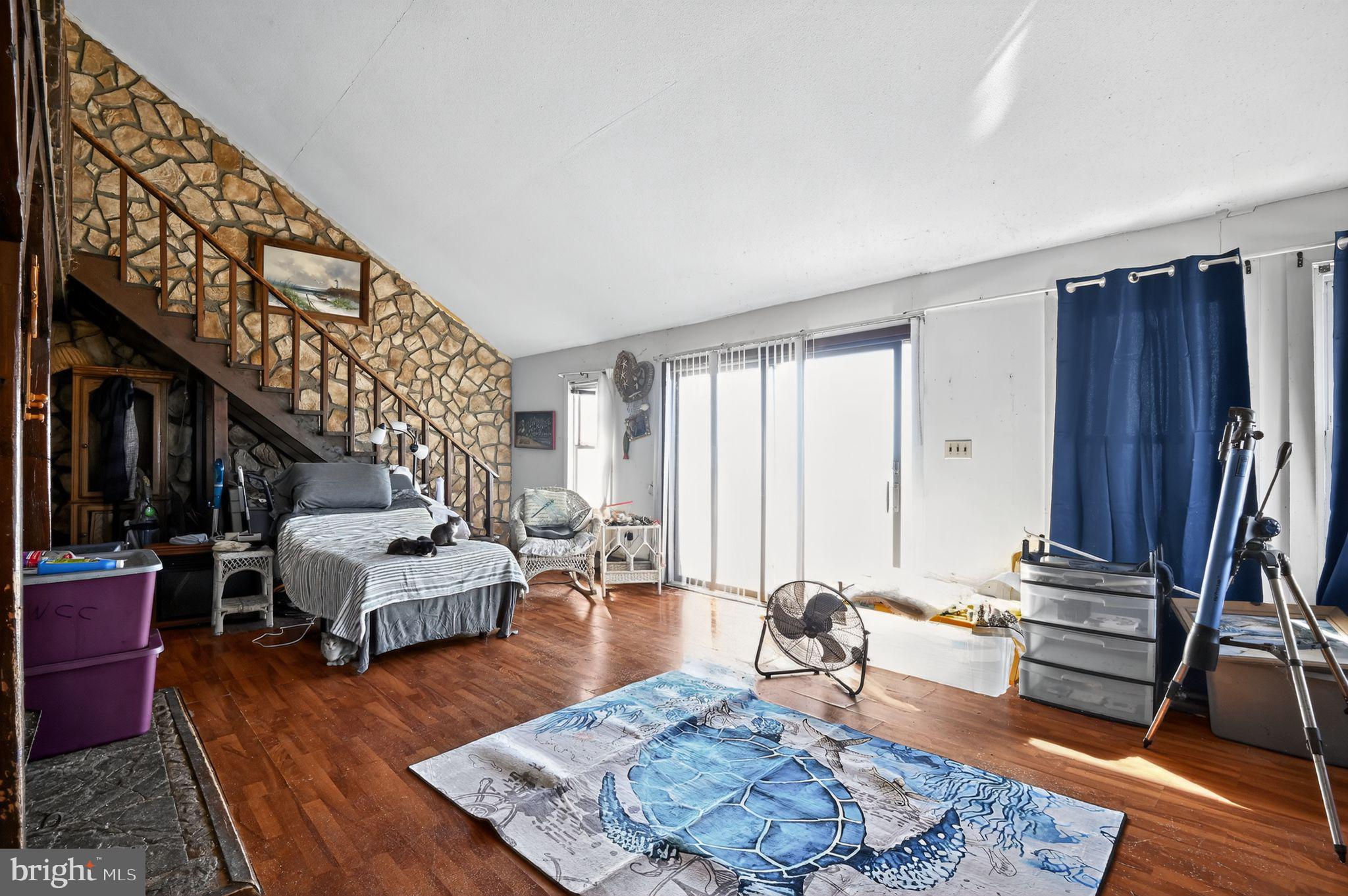 114 Delaware Avenue Fortescue, NJ 08321 - Photo 23 of 27 a living room with furniture and wooden floor