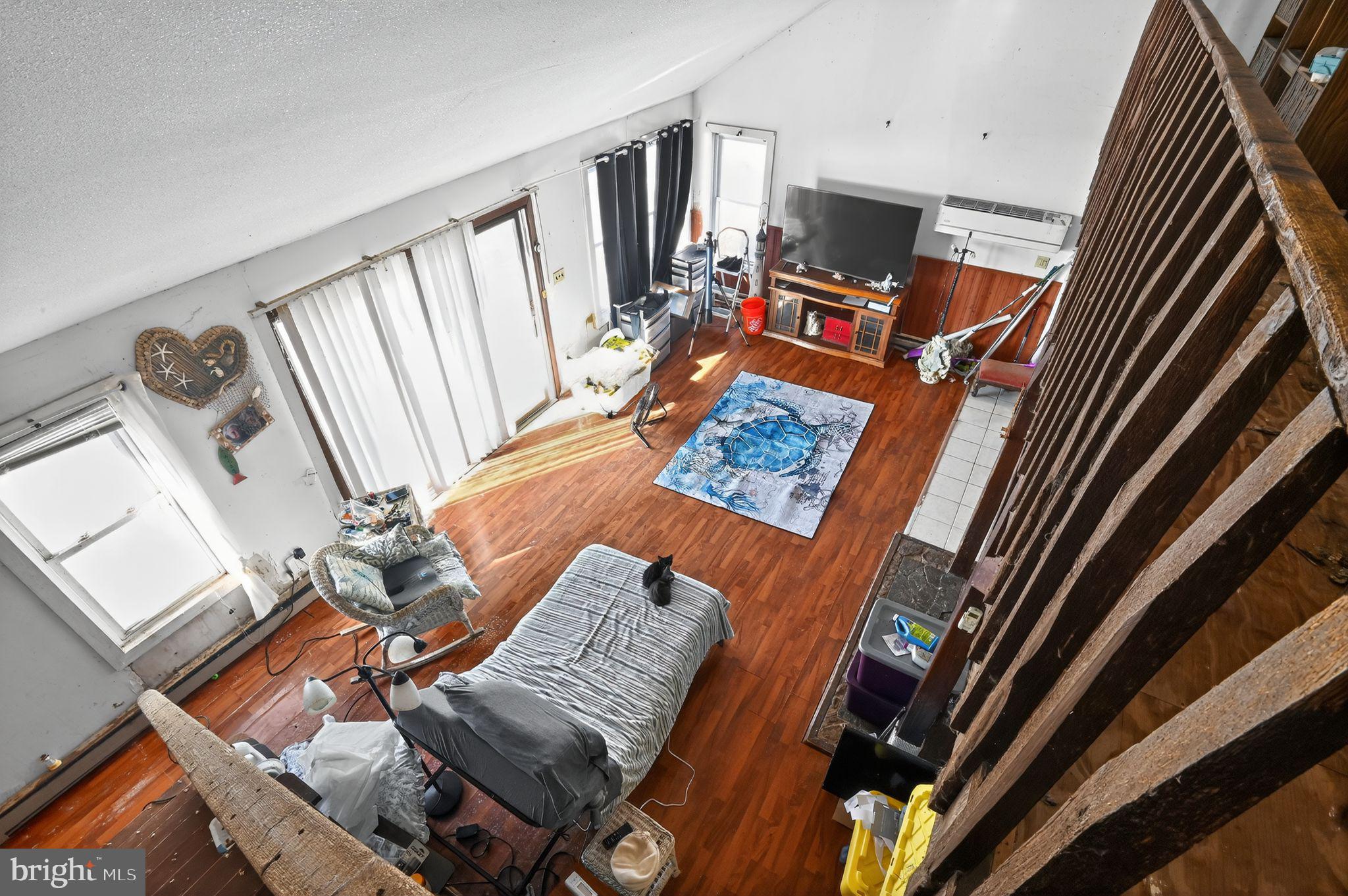 114 Delaware Avenue Fortescue, NJ 08321 - Photo 26 of 27 a living room with furniture and a flat screen tv