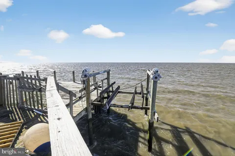 a front view of a house with sitting area