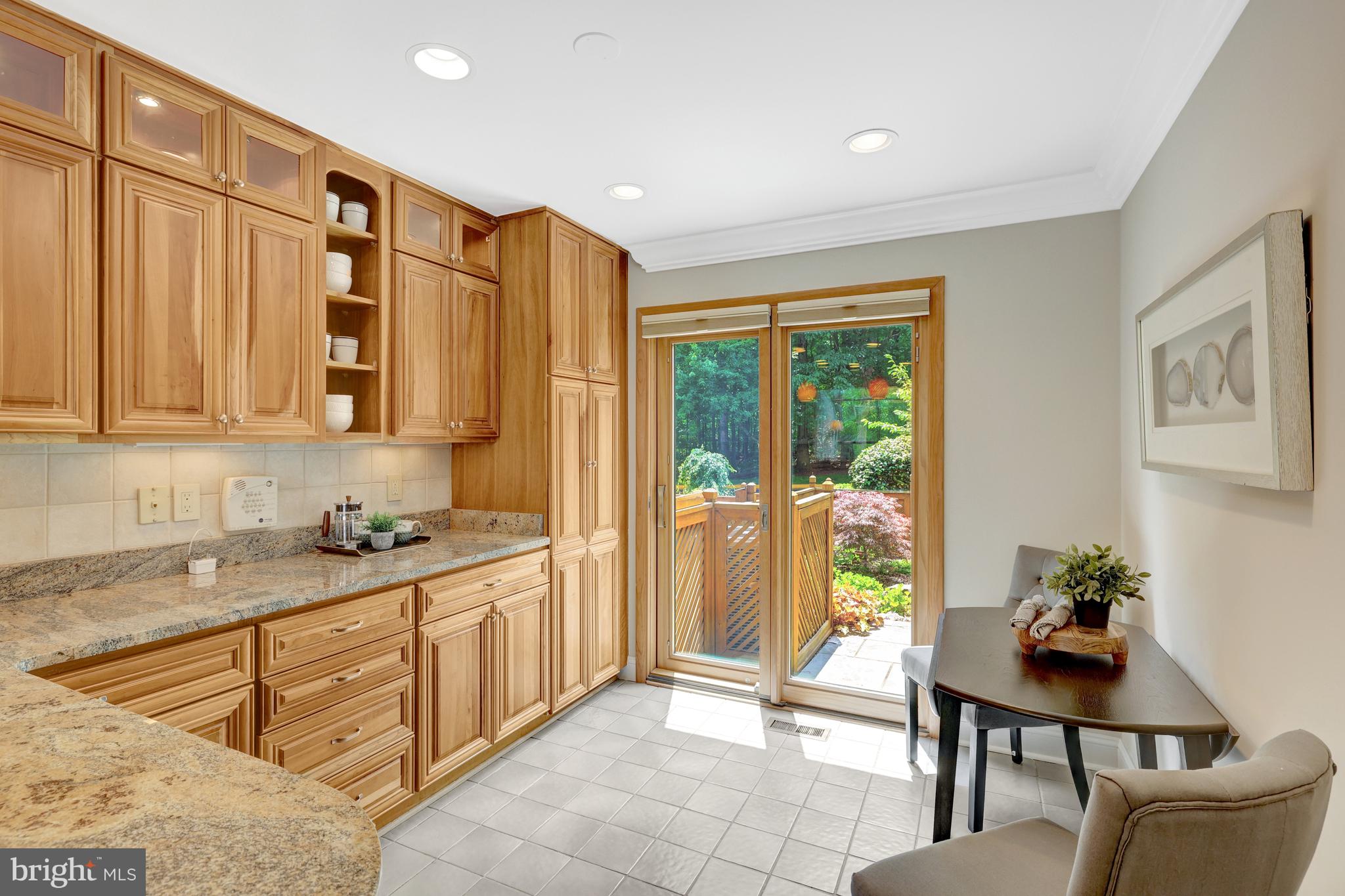 11064 Thrush Ridge Road Reston, VA 20191 - Photo 11 of 85 a spacious bathroom with a granite countertop sink a mirror a bathtub and a shower